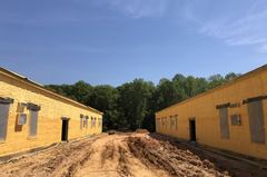 Spray foam applied to the walls of a long building under construction